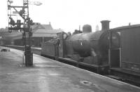 Ex-Caledonian 3F 0-6-0 no 57689 southbound on the main line through Motherwell in May 1963 with a brake van.<br><br>[Colin Miller /05/1963]