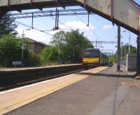 ScotRail EMU 320051 slows for the stop at Westerton on 3 June 2011<br><br>[Ken Browne 03/06/2011]