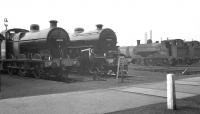 Scene in the yard at Horwich Works on 25 September 1960. Visiting locomotives include Fowler 4F 0-6-0 no 44482 of Barrow Hill, Crab 2-6-0 no 42761 of Saltley. Standing alongside is ex-LYR Class 23 no 11304, one of the departmental 0-6-0STs used within the works at that time.<br><br>[K A Gray 25/09/1960]