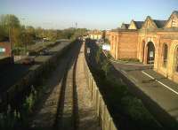 A section of the original 1838 London and Birmingham Railway, looking north through Wolverton works. It was later bypassed by the 1881 LNWR route and is now ignominiously sandwiched between an approach road to Tesco and industrial units housed in former Works buildings. The Railcare facility now served by the line is off to the left.<br><br>[Ken Strachan 14/10/2011]