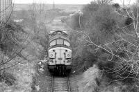 Locomotive 37080, in the hands of driver Alistair Robertson, nears Loanhead on 28 March 1991. The train of empty hoppers, believed to be the last, has been sent to clear remaining stocks of coal from Bilston Glen Colliery, which had been officially closed in 1989. [See image 37871] for the view twenty years later. <br><br>[Bill Roberton 28/03/1991]