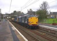 DRS class 37s nos 37607 and 37038 slowing for a signal stop at Kilwinning on 26 October with the 6M22 Hunterston - Carlisle nuclear flask train.<br><br>[Ken Browne 26/10/2011]