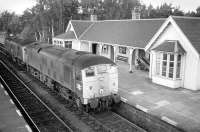 A pair of class 24s heading south through Carrbridge station in 1973. The signal box was located in the far bay window.<br><br>[Bill Roberton //1973]