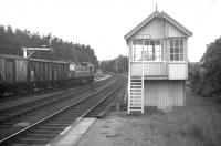 Summer 1969 at Lairg, with a Class 26 about to head south with the return working of the daily Inverness-Lairg freight. At the peak of rail activity after the discovery of North Sea oil and the opening of the Invergordon aluminium smelter, there were five daily freight trains on the Far North Line - one through to Wick and Thurso, one to Lairg and three to Invergordon. <br><br>[David Spaven //1969]