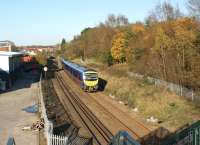 A First TransPennine service to Manchester Airport passes the site of Rylands crossing in Chorley in November 2011. When this was a foot crossing it was the scene of several near misses. The crossing has now been replaced by a footbridge and provides an ideal spot for photography.<br><br>[John McIntyre 06/11/2011]