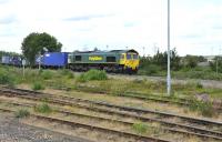 Freightliner 66538 eastbound off the Oxford curve through Didcot with a container train on 16 June 2011<br><br>[Peter Todd 16/06/2011]