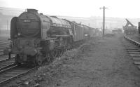 A line of locomotives in the sidings alongside Heaton shed on a misty day in October 1963. Nearest the camera is A1 Pacific no 60132 <I>Marmion</I>.<br><br>[K A Gray 21/10/1962]