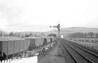D3929 takes a ballast train out of West Kilbride goods yard on the morning of Easter Sunday 1963. That particular weekend saw major track replacement and re-ballasting work carried out in the surrounding area.<br><br>[R Sillitto/A Renfrew Collection (Courtesy Bruce McCartney) 14/04/1963]