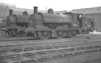 Aspinall ex-LYR Class 23 no 11304 is one of the departmental 0-6-0STs used within Horwich Works, seen here with several contemporaries in the works yard in September 1960.<br><br>[K A Gray 25/09/1960]