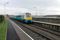 A short working from the junction to Llandudno for 175105, seen here leaving Deganwy  but it will return immediately as a through service to Manchester Piccadilly. To the right of the train, across the estuary, Conwy Castle and bridges can be seen.<br><br>[Mark Bartlett 29/11/2011]