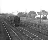 70014 <I>'Iron Duke'</I> is about to run through Beattock station with a southbound parcels train in the 1960s. The Moffat branch line is to the right. <br><br>[K A Gray //]