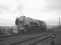 Stanier Coronation Pacific no 46225 <I>Duchess of Gloucester</I> stands alongside Carlisle no 12 signal box on 7 March 1964, shortly after moving off Upperby shed. The locomotive will travel tender first to Carlisle station where it will eventually take over a southbound WCML express.<br><br>[K A Gray 07/03/1964]
