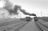 Andrew Barclay No 25 (2358 of 1954) leaves a smoke screen over the exchange sidings a little to the west of Polkemmet Colliery at it returns to the pit on 9 March 1978.<br><br>[Bill Roberton 09/03/1978]