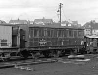 After a hard day's work, what better than a spell of sleeping and messing - although not necessarily in that order. Seen in a corner of the shed yard at Aberdeen Ferryhill in 1967 is this venerable six-wheeled 'Sleeping & Messing Van' [BR Engineer's Dept Aberdeen District DE 320564]. <br><br>[Frank Spaven Collection (Courtesy David Spaven) //1967]