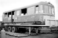 The body of withdrawn AC Cars railbus SC 79979 stands on a road trailer in a Coatbridge scrapyard in October 1977 awaiting removal to the Strathspey Railway [see image 16258].<br><br>[Bill Roberton /10/1977]