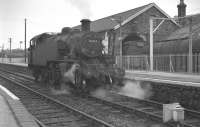 Ivatt 2-6-2T no 41314 stands at Torrington, Devon, in August 1960. The milk tank loading facilities can be seen on the right. Torrington lost its scheduled passenger service in 1965 and the last milk tanks left in October 1978.<br><br>[K A Gray 11/08/1960]