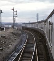 Looking back along the train as it passes through the partly demolished Bathgate Upper Station on 7 March 1971 [see image 36926]. The junction for Bathgate Lower can be seen immediately beyond the trailing driving car.<br><br>[Bill Jamieson 07/03/1971]