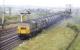 A pair of green NBL Type 2s, with No. 6121 leading, growling past Greenhill Lower box in June 1971 with a heavy block train of 45T oil tanks, probably destined for Bishopbriggs. Note that the signalman has been very sharp in restoring the signals to danger, although it is possible that the locos had been reduced to a crawl by this point! <br><br>[Bill Jamieson 16/06/1971]