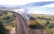 A triple-headed southbound train takes a run at the 1 in 60 gradient shortly after passing Millburn Junction, Inverness, in the summer of 1971. With 11 coaches, a restaurant car third from the front, and a Travelling Post Office at the rear, this looks like the 16.35 Inverness-Edinburgh.<br><br>[Frank Spaven Collection (Courtesy David Spaven) //1971]