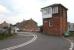 The signal box standing alongside the level crossing and former station at Low Row on the Newcastle and Carlisle line near Brampton, Cumbria, looking south on 6 May 2006. What at first glance appears to be the signal box nameboard in fact states 'Railway Inn [100 Yds]'. [See image 52631]<br><br>[John Furnevel 06/05/2006]