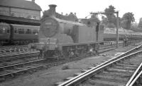 Drummond 0-4-4T no 30040 and minder take five alongside Bournemouth shed in August 1960.<br><br>[K A Gray 09/08/1960]
