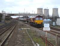 DBS 66041 running round its coal train alongside Didcot power station on 5 January following arrival from Avonmouth.<br><br>[Peter Todd 05/01/2011]