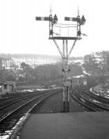 Looking towards the junction with the Largs branch from the end of the platform at Fairlie Pier on 25 February 1963. Following closure, the ex-GSWR lower quadrant signals became a permanent exhibit at the Glasgow Museum of Transport [see image 30248]. <br><br>[R Sillitto/A Renfrew Collection (Courtesy Bruce McCartney) 25/02/1963]