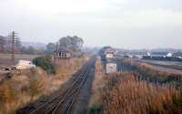 An October 1974 view of the old signal box and extensive goods yard at Brechin. At the time - 6 years before closure - the Kinnaber Junction to Brechin branch was handling a variety of agricultural and coal traffic, plus - as seen in this photograph - pipes for the North Sea oil sector. The pipe traffic was later switched to Laurencekirk [see image 12553], then Dyce, while the Brechin to Bridge of Dun line gained a new lease of life as the preserved Caledonian Railway.<br><br>[Frank Spaven Collection (Courtesy David Spaven) /10/1974]