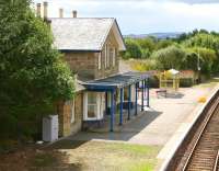 The attractive 1864 station at Fearn, seen from the B9165 road bridge in the summer of 2007. Looking south west along the platform in the general direction of Invergordon.<br><br>[John Furnevel 30/08/2007]