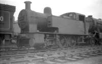 Fowler 2F 0-6-0T no 47162 (minus some key components), photographed in the 'stored' sidings at Bathgate in April 1959. The locomotive is recorded as being officially withdrawn from Dalry Road shed, where it had spent its entire post-nationalisation life, some 8 months later at the end of that year.<br><br>[Robin Barbour Collection (Courtesy Bruce McCartney) 21/04/1959]