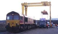 Scene at Elgin freight depot on 2nd April 2002 during a woodchip-by-rail demonstrator project managed by the photographer for Scottish Enterprise. Unfortunately, the crane failed at the vital moment, and the laden container had to be sent by road to Mossend...<br><br>[David Spaven 02/04/2002]