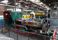 Although the railway locomotives in the Power Hall at Manchester Museum of Science and Industry are all static exhibits there are numerous working stationary steam engines and so the smell of steam and hot oil gives the building a special atmosphere. Isle of Man Railway 2-4-0T No. 3 <I>Pender</I> was constructed by Beyer Peacock in 1873 at Gorton and is now a sectioned exhibit with other Manchester built locomotives behind. <br><br>[Mark Bartlett 30/12/2011]