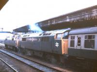 A pair of Class 52 <I>'Western'</I> diesel-hydraulic locomotives double heading a train at Exeter St Davids in 1977.<br><br>[Ian Dinmore //1977]