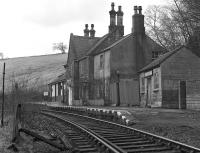Lambley station on the Alston branch in March 1976, displaying both a corporate image BR running-in board at the far end and a North Eastern Region painted board (doubtless with a tangerine background) above the door of the somewhat decrepit shed on the right.<br><br>[Bill Jamieson 27/03/1976]