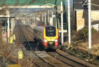 A southbound Virgin Voyager passes Hest Bank level crossing heading for the Lancaster stop on 28 January 2012.<br><br>[John McIntyre 28/01/2012]