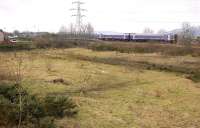 A Fife outer circle 158 service draws away from Lochgelly Station on 31 January 2012. In the foreground is the partially redeveloped site of the goods yard and rail-served gasworks.<br><br>[Bill Roberton 31/01/2012]