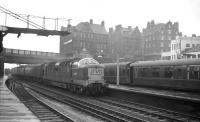 A diverted ECML service at Carlisle on Saturday 25 April 1964. Deltic D9010 <i>'The King's Own Scottish Borderer'</i> runs through platform 4 with the 9.30am Glasgow Queen Street - London Kings Cross. The Deltic had taken charge from Edinburgh and had reached Carlisle via the Waverley Route. After passing through the station the train would turn east onto the Newcastle & Carlisle line. [With thanks to Paul Bettany]<br><br>[K A Gray 25/04/1964]