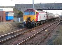Virgin 'Thunderbird' no 57304 <I>Gordon Tracy</I>, on hire to GBRf to handle the 334020 drag to Brodie Rail Works, Kilmarnock. The locomotive is seen on 3 February 2012 leaving Barassie sidings with a train from the Kilmarnock works consisting of 'translator' vehicles for Glasgow Works and coaches for SRPS Bo'ness.<br><br>[Ken Browne 03/02/2012]