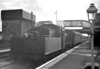 The single coach St Boswells - Berwick branch train stands alongside the platform at Kelso on 10 September 1962. Hawick shed's standard class 2 2-6-0 no 78049 is the locomotive in charge.<br><br>[R Sillitto/A Renfrew Collection (Courtesy Bruce McCartney) 10/09/1962]