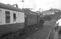 Taking on water at Blackburn on 4 August 1968 is BR Standard class 5 4-6-0 no 73069. The locomotive had recently arrived from Manchester Victoria [see image 31774] with the RCTS <I>'End of Steam Commemorative Railtour'</I> piloted by 8F no 48476. The 8F was about to be replaced by Black 5 no 45407 for the journey to Lostock Hall via Hellifield, Skipton and Burnley. The special would return to Euston later that day from Stockport behind E3183.<br><br>[K A Gray 04/08/1968]