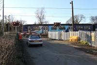 On the day the contractors moved in to upgrade Bolton-le-Sands level crossing, 150228 passes on a Morecambe to Leeds service. The station, closed in 1969 and removed, was on the right of the picture [See image 20171]. Nearby Hest Bank and Bare Lane crossings are also being modernised during Spring 2012 with their signal boxes scheduled to disappear. (See News item.)<br><br>[Mark Bartlett 05/03/2012]