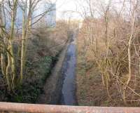 View north from Edgefield Road bridge, Loanhead, on 5 March 2012 showing the trackbed of the Roslin branch looking back towards Millerhill. After many years as an impassible rubbish strewn undergrowth the route has been cleaned up and turned into a walkway/cycle path. [See image 36126] for the view twenty years earlier showing the last train over the line.<br><br>[John Furnevel 05/03/2012]