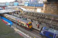 View over the former suburban platforms at Waverley on 6 March 2012, with class 334 and 380 units and a pair of CrossCountry Voyagers visible. Work is well underway on the refurbishment of the canopies and the accesss stairway.<br>
<br><br>[Bill Roberton 06/03/2012]