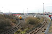 Panorama of Heysham Port area on 6 March 2012 as DRS Class 20 20309 leads two flasks plus 20308 down the short branch from the power station. On the right is the line leading to the passenger station at the Port terminal. The lines meet just under the bridge from which the photograph was taken.<br><br>[Mark Bartlett 06/03/2012]