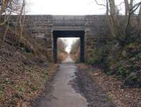 Looking south along the trackbed of the former Roslin Branch through Edgefield Road bridge on 5 March 2012 on the approach to Loanhead. [See image 37871]<br><br>[John Furnevel 05/03/2012]