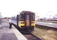 The guard about to board a 153 unit at Cleethorpes station in August 1995 due to leave on a Saturday service to Barton on Humber.<br><br>[Ian Dinmore 12/08/1995]