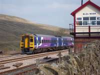A Carlisle-bound Northern service formed by 158855 passing Blea Moor Signal Box on 18 April 2011.<br><br>[Andrew Wilson 18/04/2011]
