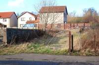 The former approach road to Torryburn Station on 4 March 2012. Houses have been built on the site, behind which runs the Culross/Longannet line. Note the lengths of rail used as a gatepost and fence supports. [See image 6481]<br><br>[Bill Roberton 04/03/2012]