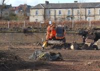 The site of Dunfermline Locomotive Depot is being redeveloped. View north to the retaining wall below the old main line, now a footpath, on 11 March 2012.<br><br>[Bill Roberton 11/03/2012]