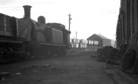 A late September afternoon at 64C Dalry Road shed in 1961 looking east  towards the back of the coaling stage [see image 27595]. The locomotive is McIntosh ex-Caledonian 0-4-4T no 55124, officially withdrawn by BR that same month. Final disposal took place at Arnott Young, Troon, some 2 years later.<br><br>[K A Gray 25/09/1961]